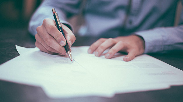 doctor working through paperwork